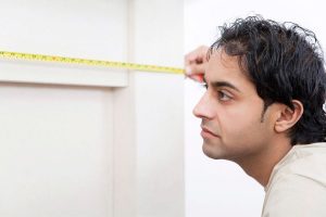 Man measuring with tape